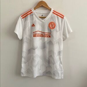 Atlanta United Soccer 
Adidas women’s White and Orange jersey XL